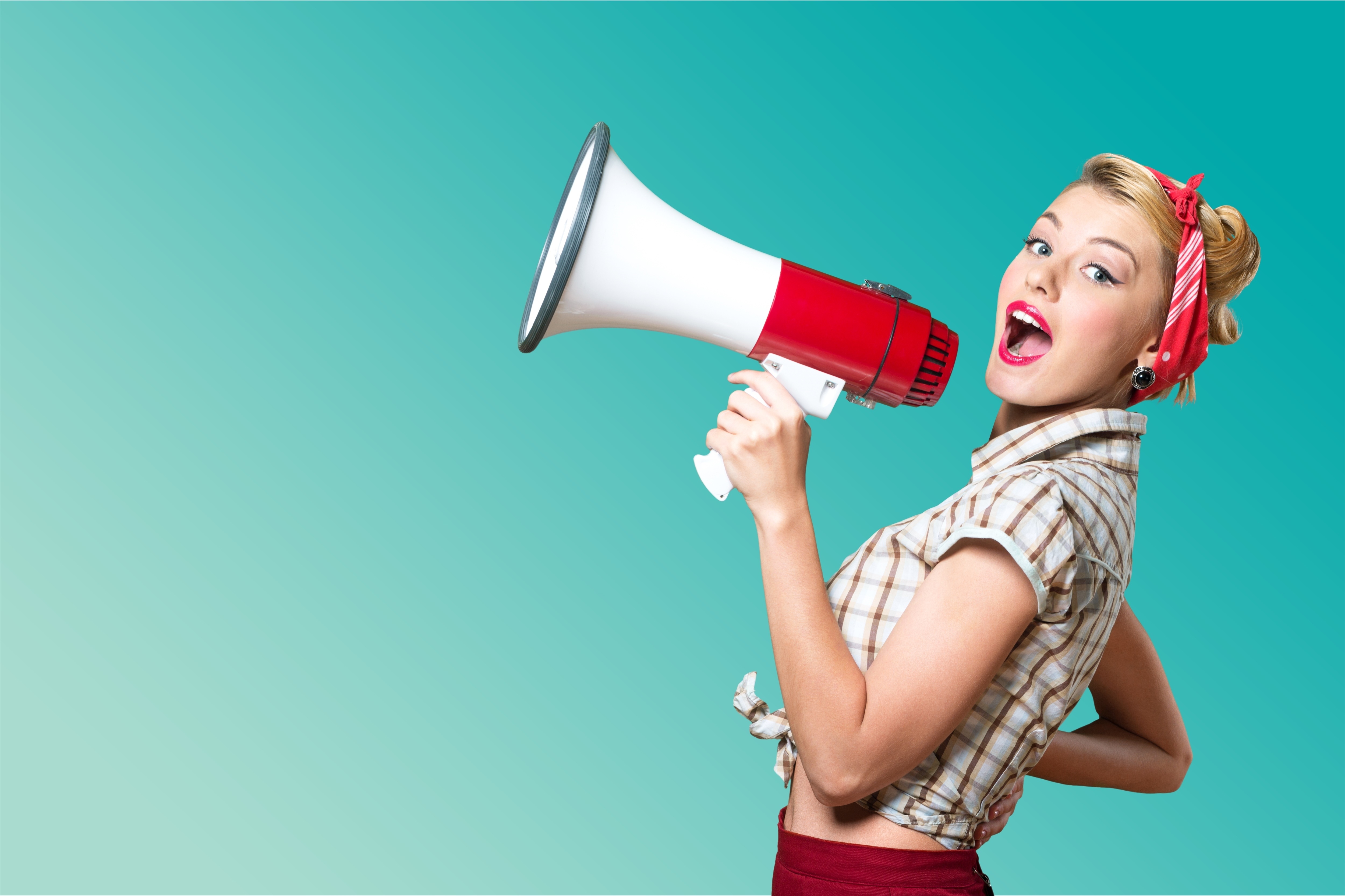 Portrait of woman holding megaphone, dressed in